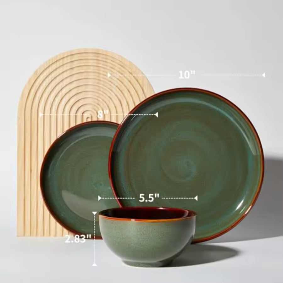 Set of green ceramic dinnerware with brown rim on a white background