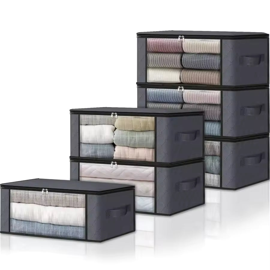 Six charcoal grey fabric storage bags with clear windows and reinforced handles, stacked to show closet organization for sweaters and bedding.