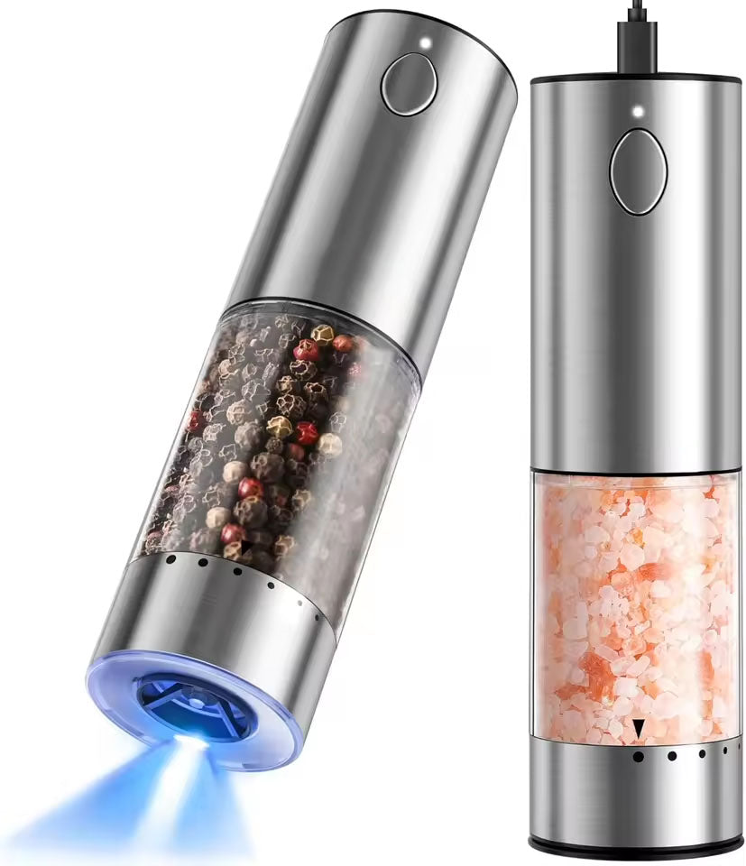 Pair of silver stainless steel electric salt and pepper grinders with LED lights, showing automatic grinding of black pepper and pink salt.