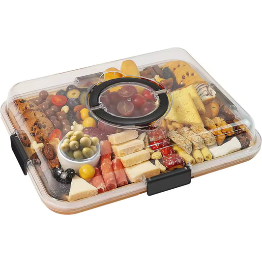 Large rectangular bamboo charcuterie board with 6 compartments filled with olives, cheese, and crackers, covered by a clear portable lid with a handle.