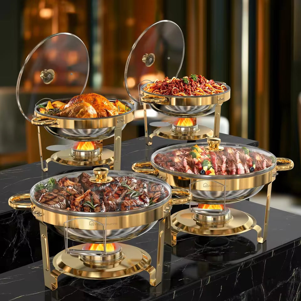 Set of two round gold-plated 5QT chafing dishes with clear glass lids and fuel holders, showcasing hot food inside.