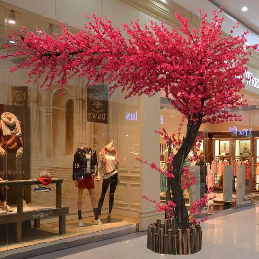 Large artificial peach and cherry blossom tree in red maple color for wedding, hotel lobby, and exhibition venue decoration.