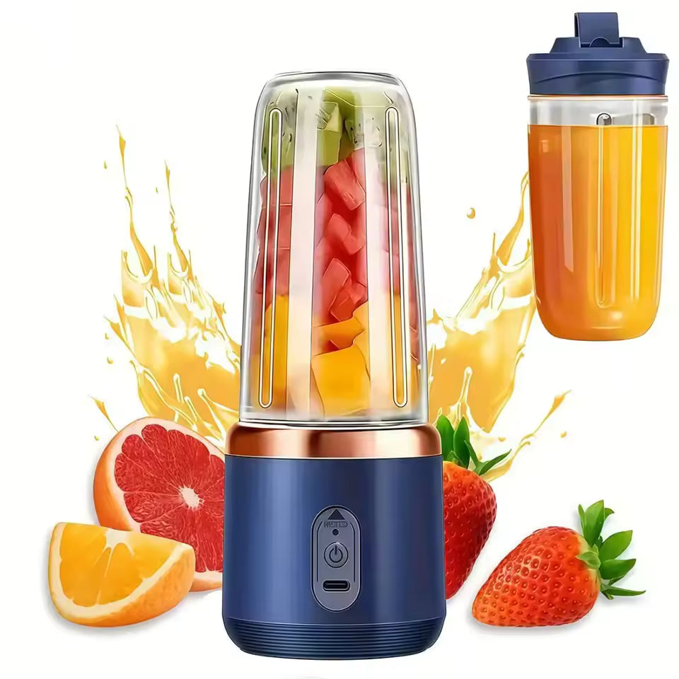 Navy blue and rose gold portable juicer blender with a 450ml clear cup filled with fresh fruit slices, showing a strawberry and orange background.