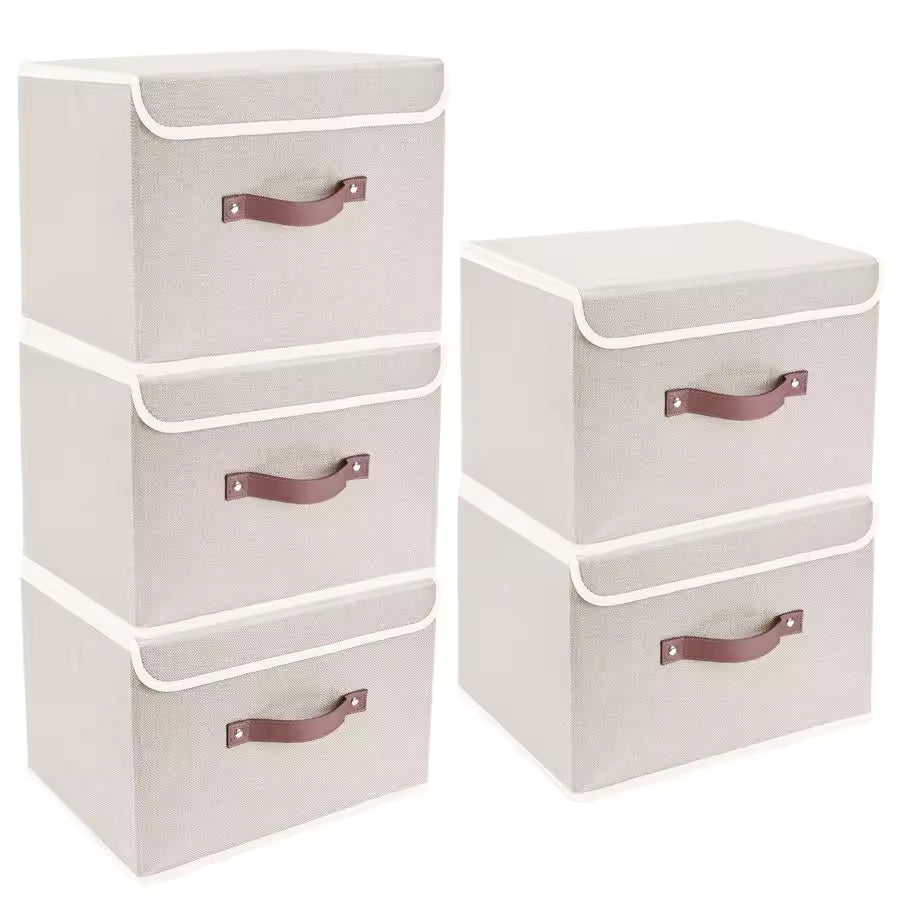 Set of five white fabric storage boxes with lids and brown handles, shown organized in a modern living room and a closet for clothes storage.