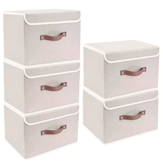 Set of five white fabric storage boxes with lids and brown handles, shown organized in a modern living room and a closet for clothes storage.