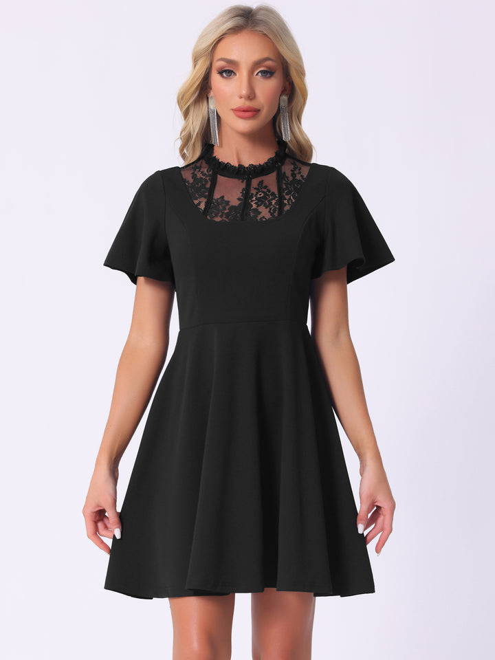 Black dress with lace details on a white background