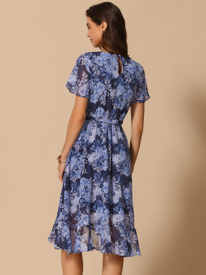 Woman wearing a blue floral dress against a beige background