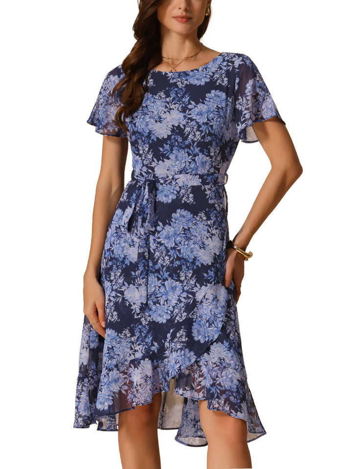 Woman wearing a blue floral dress on a white background