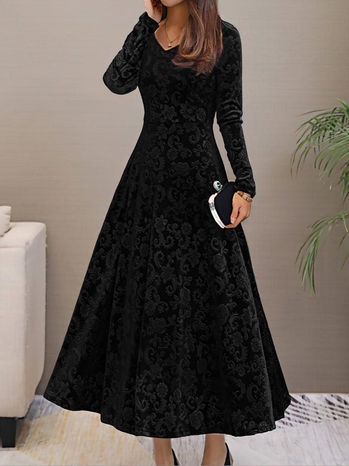 Black floral dress worn by a person in an indoor setting